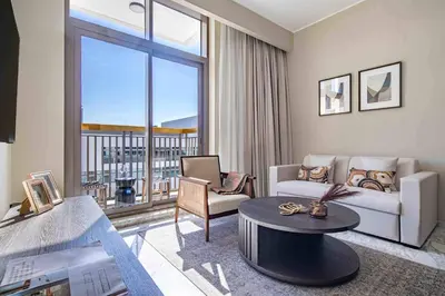 a living room with a couch and a table at Frank Porter - Avenue Residence in Dubai