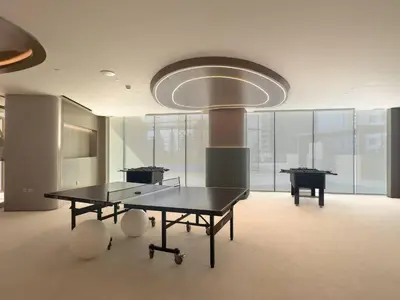 a large room with two ping pong tables in it at High-End Living With Private Pool in Dubai