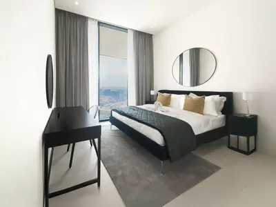 a bedroom with a bed and a mirror and a piano at High-End Living With Private Pool in Dubai