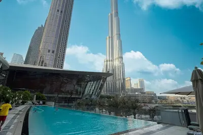a swimming pool in a city with tall buildings at Mahogany 24 - 2BR 6 PAX - On the Boulevard Sea View in Dubai