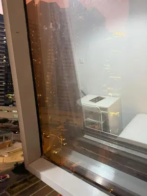 a view of a city from a window in a building at Modren Private Partition Room In Barsha Heights Tecom in Dubai