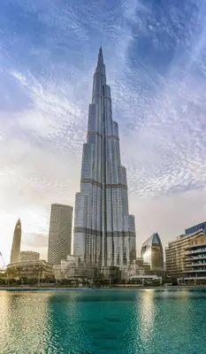 a large skyscraper in a city next to a body of water at Luxury 3 BR in Dubai Marina in JBR Beach in Dubai