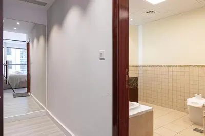 a bathroom with a toilet and a sink at Chic JBR Apartment Beach Walk Dining Nightlife in Dubai