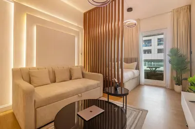 a living room with a couch and a table at Lux condo 3 BHK in Dubai Marina in Dubai