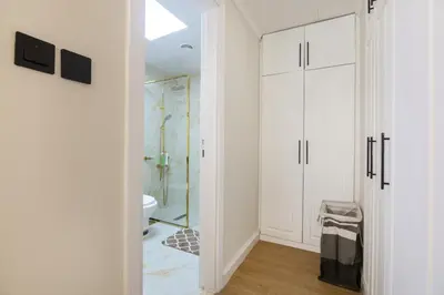 a bathroom with a shower and a glass door at Lux condo 3 BHK in Dubai Marina in Dubai