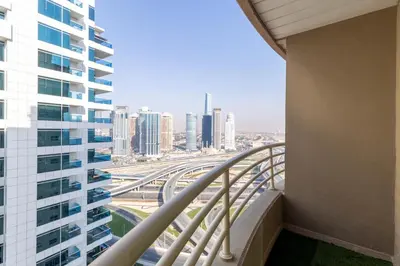 a view of the city from the balcony of a building at Luxury 3BR & Floating Bed in Marina with Pool in Dubai