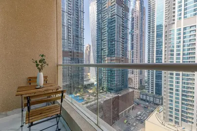 a balcony with a bench and a view of a city at Elegant 2-Bedroom Apartment in Marina Heights 1, Dubai Marina in Dubai