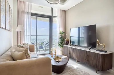 a living room with a large flat screen tv at Frank Porter - Aykon City, Business Bay in Dubai