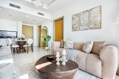 a living room with a couch and a table at Frank Porter - Aykon City, Business Bay in Dubai