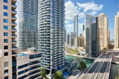 a city skyline with tall buildings and a river at Frank Porter - Damac Waves Tower, Dubai Marina in Dubai