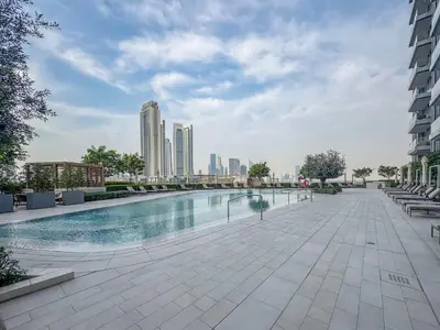a swimming pool in a city with tall buildings at Frank Porter - Vida Dubai Mall in Dubai