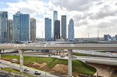 a highway in a city with tall buildings at Frank Porter - Opal Tower in Dubai