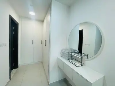 a white bathroom with a mirror and a sink at Vezul Residence, Business Bay - 2 Bedroom Apartment - Allsopp & Allsopp in Dubai