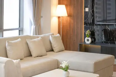 a living room with a couch and a table at Lux Unit Breathtaking Burj View I Walk Dubai Mall in Dubai