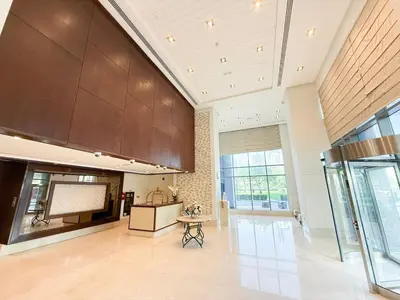 a large living room with a table in the middle at Lux Unit Breathtaking Burj View I Walk Dubai Mall in Dubai