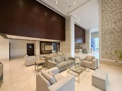 a large living room with couches and a table at Lux Unit Breathtaking Burj View I Walk Dubai Mall in Dubai
