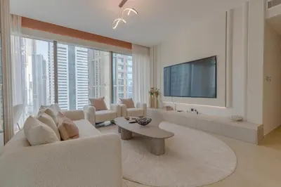 a living room with a couch and a tv at The Residences Marina Gate 1 - 2 Bedroom Apartment - Allsopp & Allsopp in Dubai
