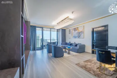 a living room with a couch and a table at Blvd Point-Full Burj Khalifa View-Downtown in Dubai