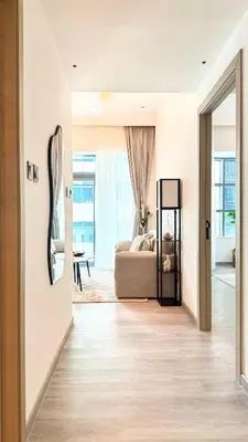a living room with a bed and a mirror at Stylish 1BDR Centrally Located for 4 Persons in Dubai