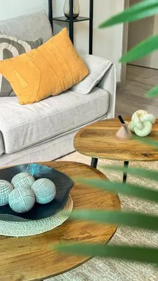 a living room with a couch and a table at Stylish 1BDR Centrally Located for 4 Persons in Dubai
