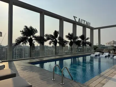 a swimming pool on the roof of a building at Boutique-Style Luxury Studio in Hyde Walk in Dubai