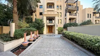 a building with a walkway in front of a building at Massive 2,000 sqft 1BR with Private Terrace & BBQ in Dubai