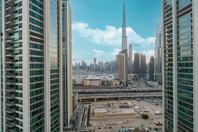 an aerial view of a city with tall buildings at Modern 2BR, Burj & Fountains View, Dubai Mall 2 Minutes Walk in Dubai