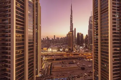 an aerial view of a city with tall buildings at Modern 2BR, Burj & Fountains View, Dubai Mall 2 Minutes Walk in Dubai