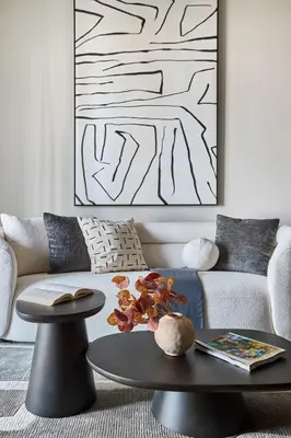 a living room with a couch and a table at Frank Porter - Concept Residences in Dubai
