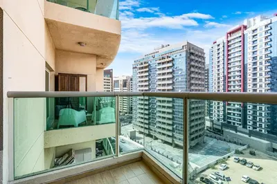 a balcony with a view of buildings at Elegant Minimal Studio with Balcony in Dubai