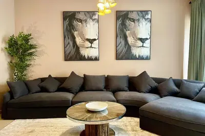 a living room with a couch and a table at Specious apartment in Sadaf 7 with Marina Views and Beach Access in Dubai