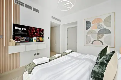 a white bedroom with a large bed in it at Golden Stays - Tranquil 4BR Villa with Pool & Coastal Charms in Dubai