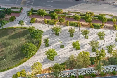an overhead view of a park with trees and bushes at Stylish Bella Rose Stay Pool & Gym in Dubai