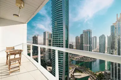 a balcony with a view of the city at Luxury 1BR Lake View Near Metro & Marina in Dubai