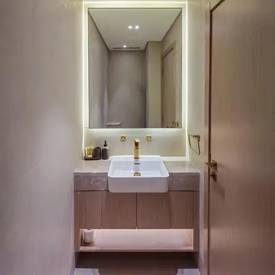 a bathroom with a sink and a mirror at Brand new apartment with luxury furniture in JVC in Dubai