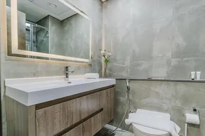 a bathroom with a sink and a toilet at RH-Smart Studio Near Expocity & Al Maktoum Airport in Dubai