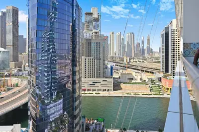 a view of a city with a river and buildings at Golden Stays - Opulent 2BR View Residence at The Bay in Dubai