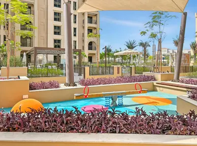 a pool at a resort with a basketball on it at Modern 1BR in Jadeel 2 MJL in Low Floor in Dubai