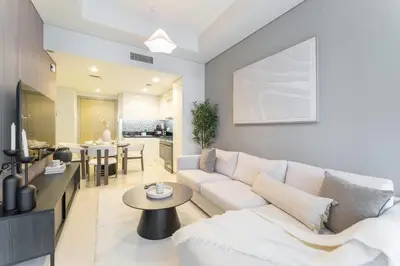 a living room with a white couch and a table at StayShort - Inviting 2BR in Business Bay with Wonderful Views in Dubai