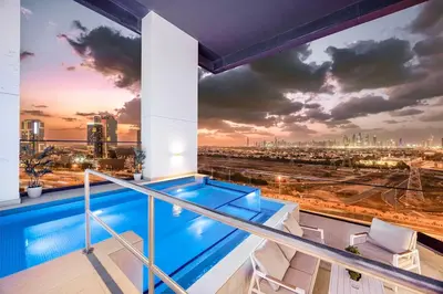 a view from the balcony of a building with a swimming pool at FiveX Binghatti 2BR with Private Pool in Dubai