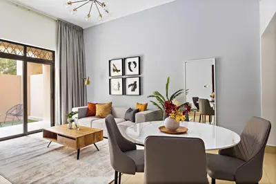 a living room with a couch and a table at Silkhaus Private Garden in Old Town Zanzebeel Bldg in Dubai