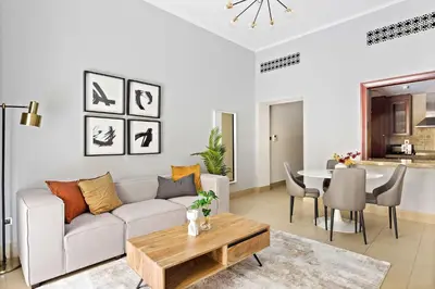 a living room with a couch and a table at Silkhaus Private Garden in Old Town Zanzebeel Bldg in Dubai