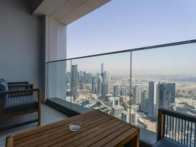 a room with a table and a view of a city at Timeless Elegance 1BR Address Beach JBR in Dubai