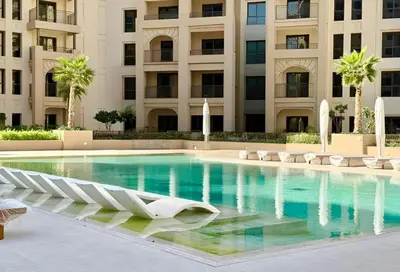 a swimming pool in front of a building at HAVN - 1 bedroom in Madinat Jumeirah Living in Dubai