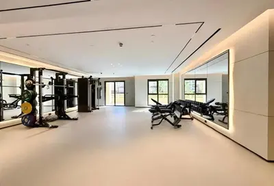 a gym with treadmills and cardio equipment in a room at HAVN - 1 bedroom in Madinat Jumeirah Living in Dubai