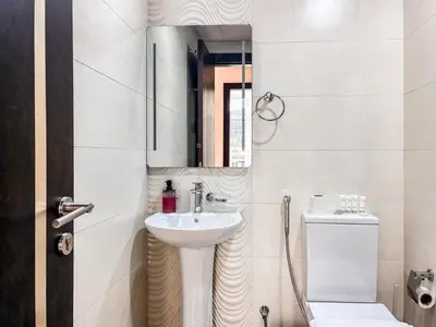 a bathroom with a sink and a mirror and a toilet at Jewelz by Danube, Arjan, Al Barsha - Onelink in Dubai