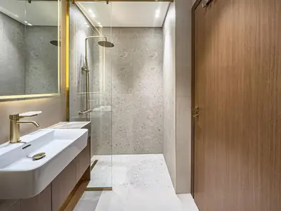 a bathroom with a sink and a shower at Modern Studio with Private Jacuzzi in Dubai