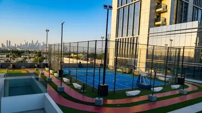 a view of a building with a pool on the roof at Jumeirah Village Triangle in Dubai