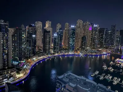 a view of a city at night with a bridge at Full marina view private pool vip adult only no halal in Dubai