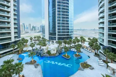 an aerial view of a resort with a pool at Amazing 1BR DAMAC Towers by Paramount in Dubai